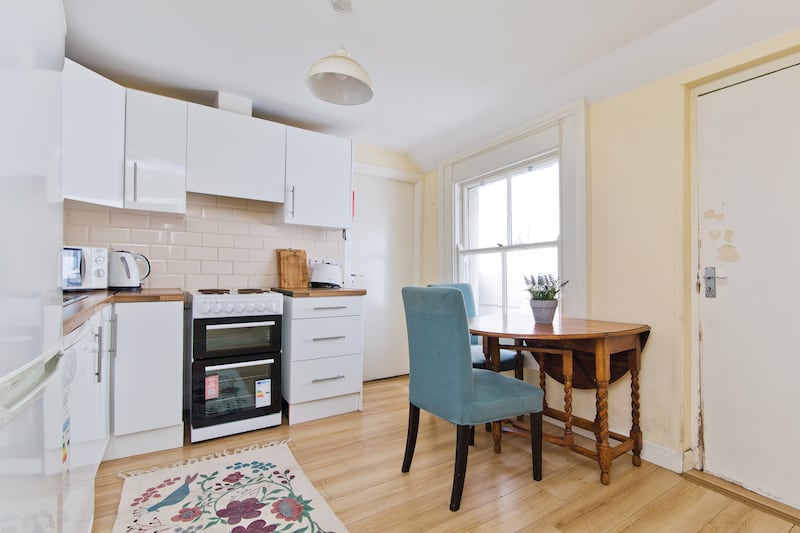 Existing kitchen in centre of plan