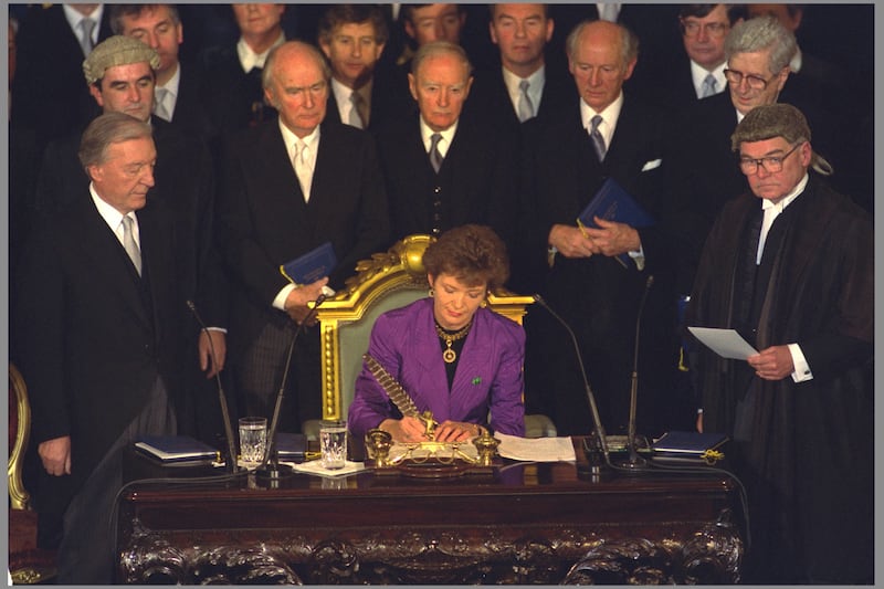 Mary Robinson chose a Louise Kennedy two-piece suit in purple silk moire for her inauguration in 1990