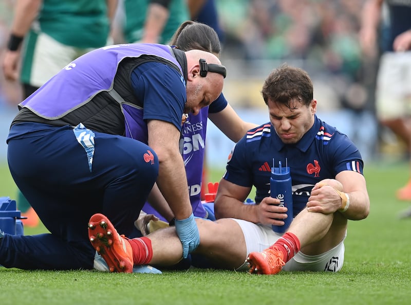 Antoine Dupont receives treatment before leaving the field after picking up an injury during the 2025 Six Nations game between Ireland and France at the Aviva Stadium. Photograph: Charles McQuillan/Getty Images