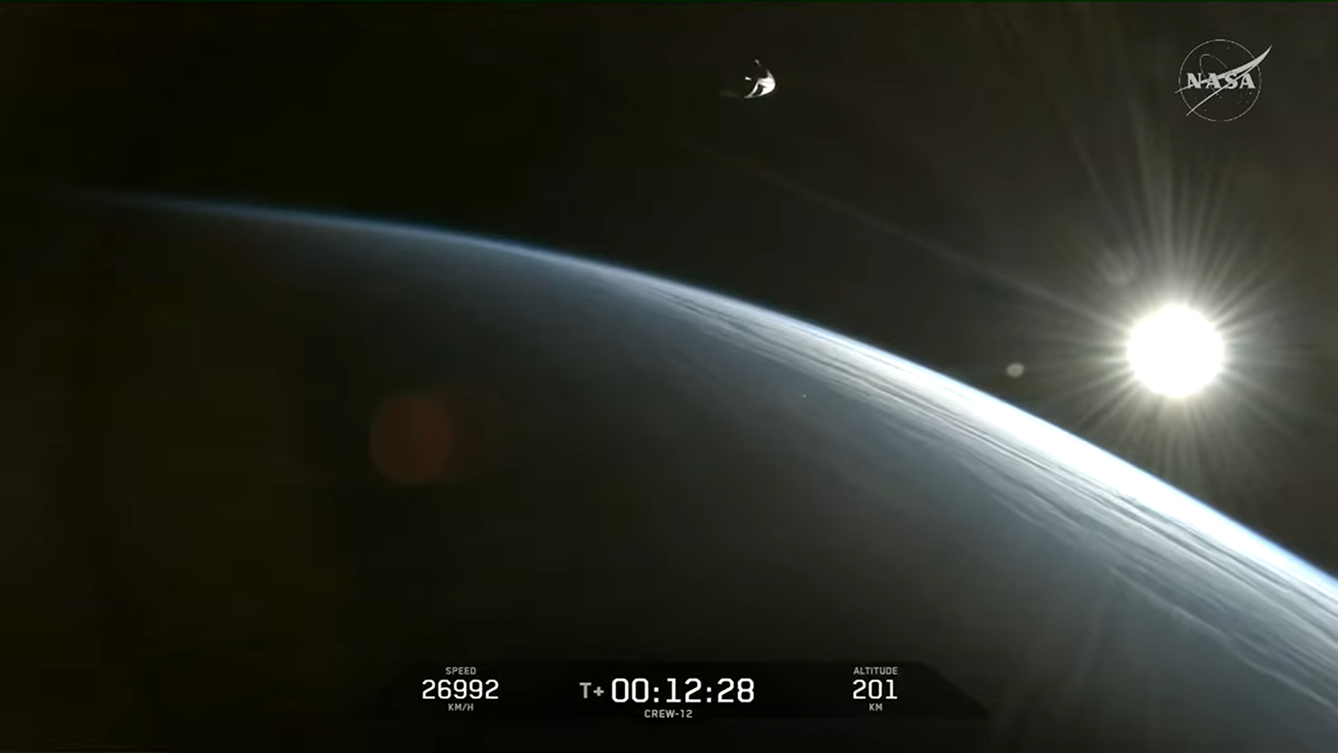 SpaceX Crew-12 Dragon flies free over the Earth during a sunrise