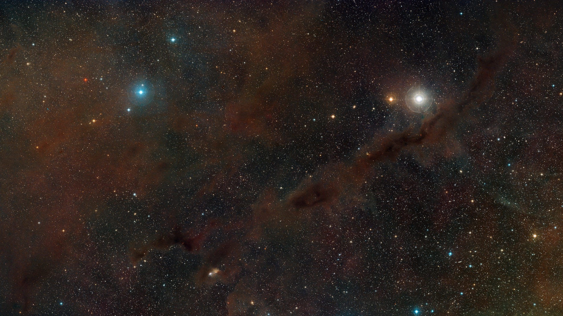 a cloud of reddish-brown gas in space