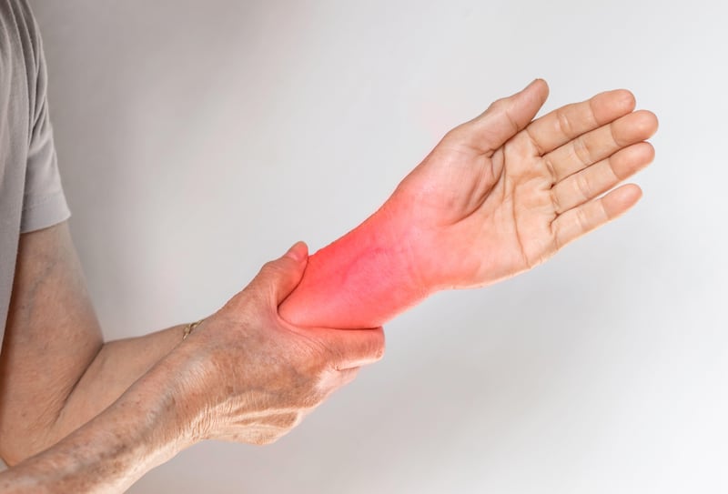 Senior woman experiencing wrist joint inflammation