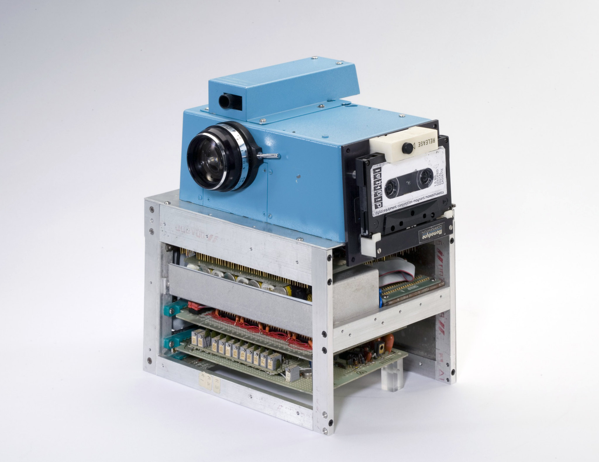The first digital camera invented by Steve Sasson on a white background