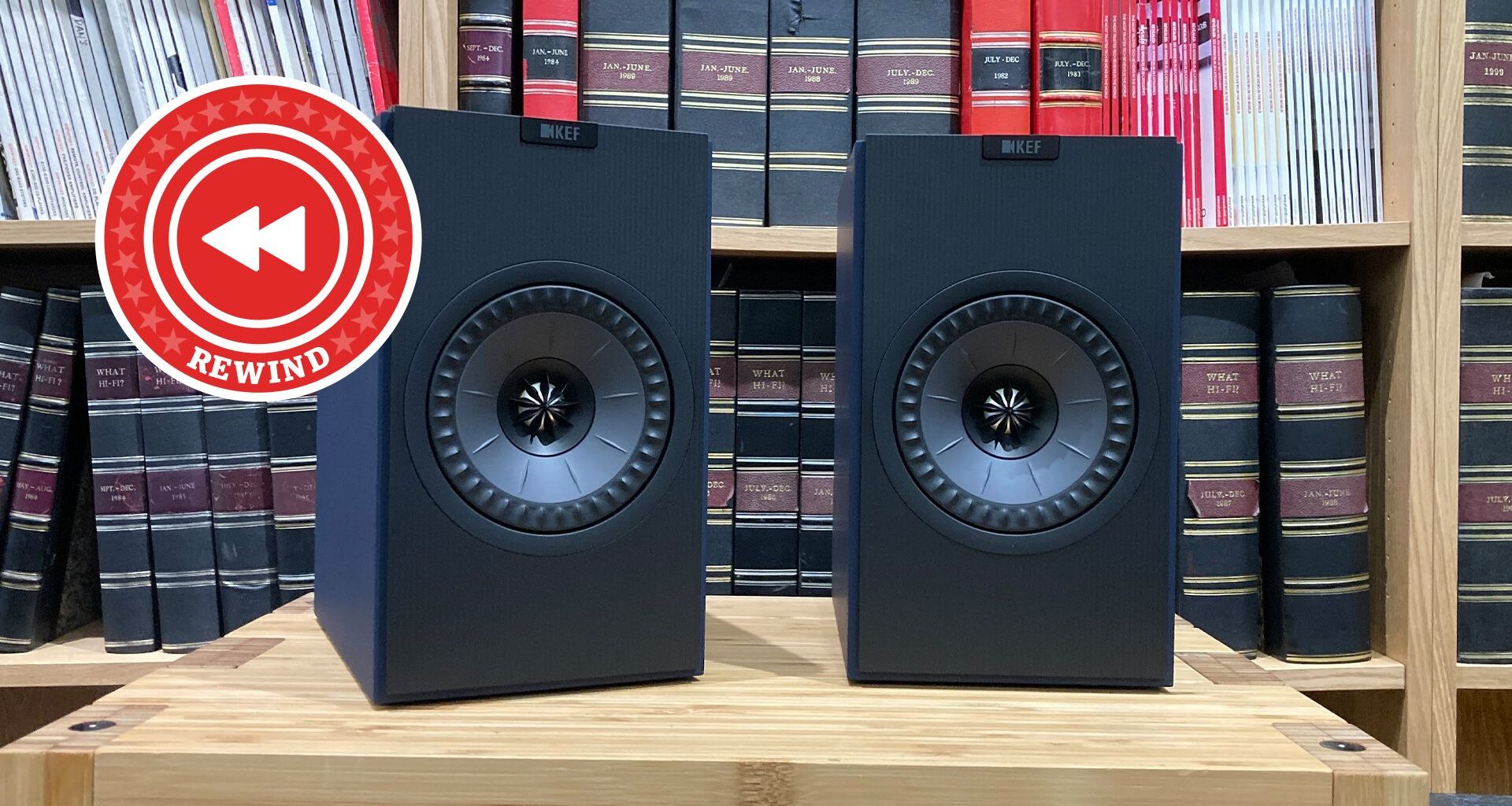 KEF speakers on table with Rewind logo