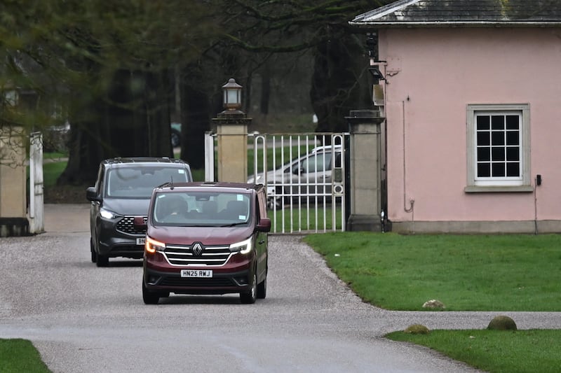 Unmarked police vehicles exit the gates of the Royal Lodge, Andrew Mountbatten-Windsor's former residence in Windsor on Thursday. Photograph: Leon Neal/Getty Images