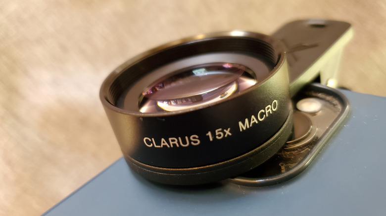 An iPhone with Xenvo lens kit attached