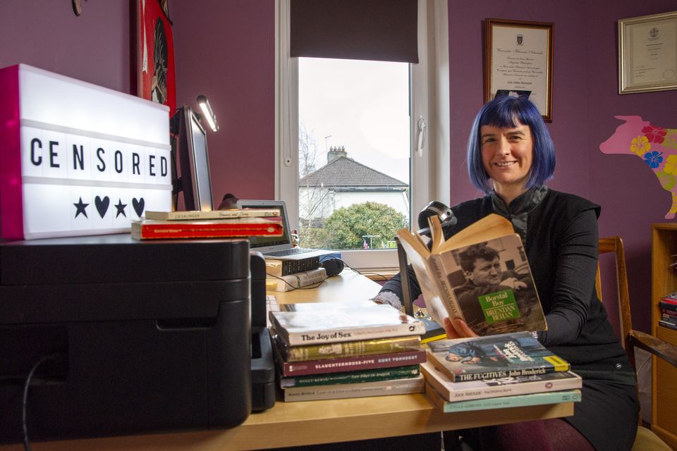 ‘Material coming through the post was censored’: Podcaster Dr Aoife Bhreatnach with some banned books at her home in Cork. Photo: Daragh Mc Sweeney/Provision