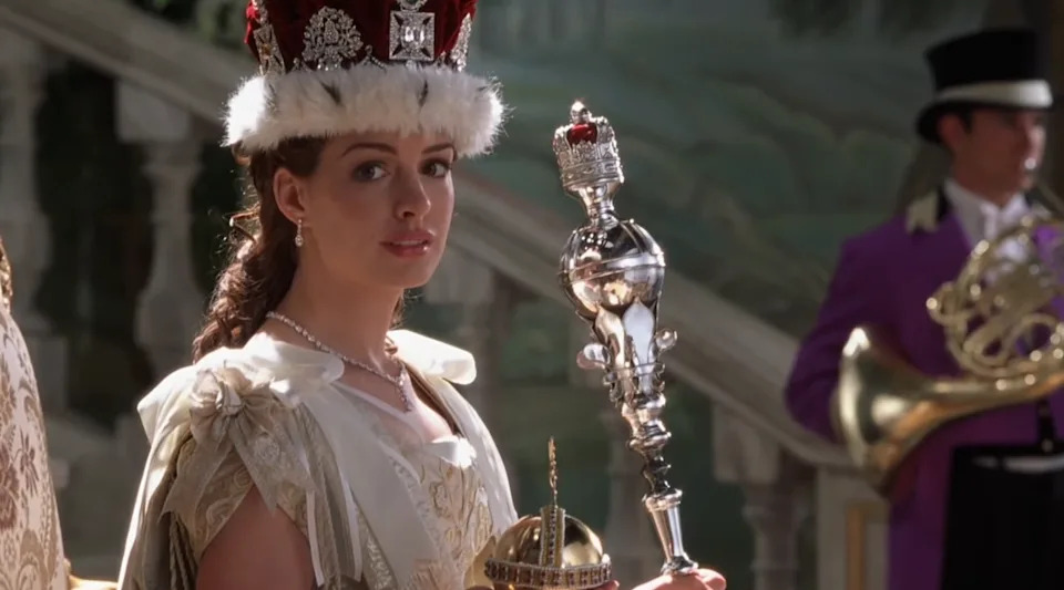 A character in royal attire holds a scepter and a crown orb, with a background of a grand staircase and musicians