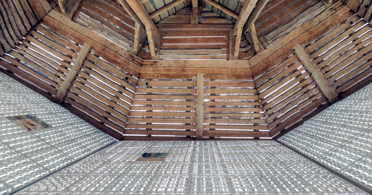 alexandre de betak inserts reflective light installation into swiss barn