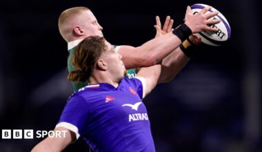 Dylan McNeice and Nils Punti challenge for the ball