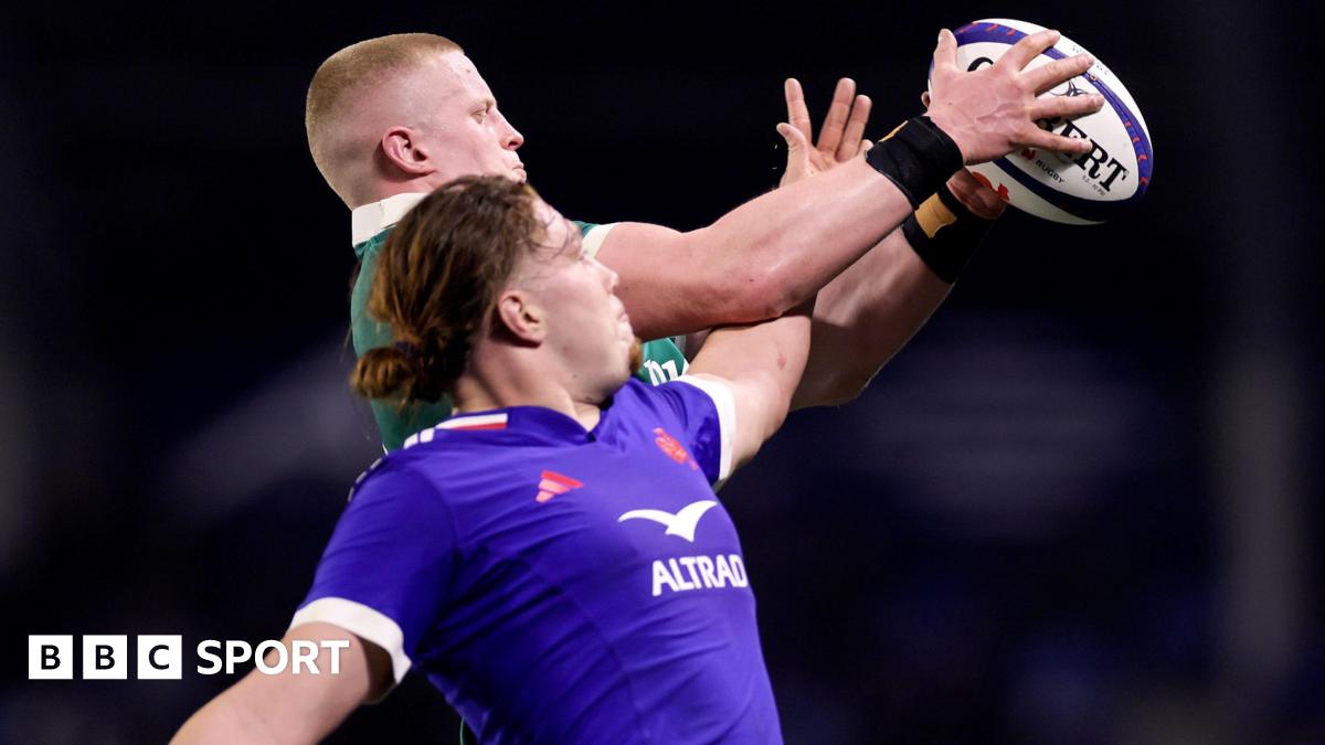 Dylan McNeice and Nils Punti challenge for the ball