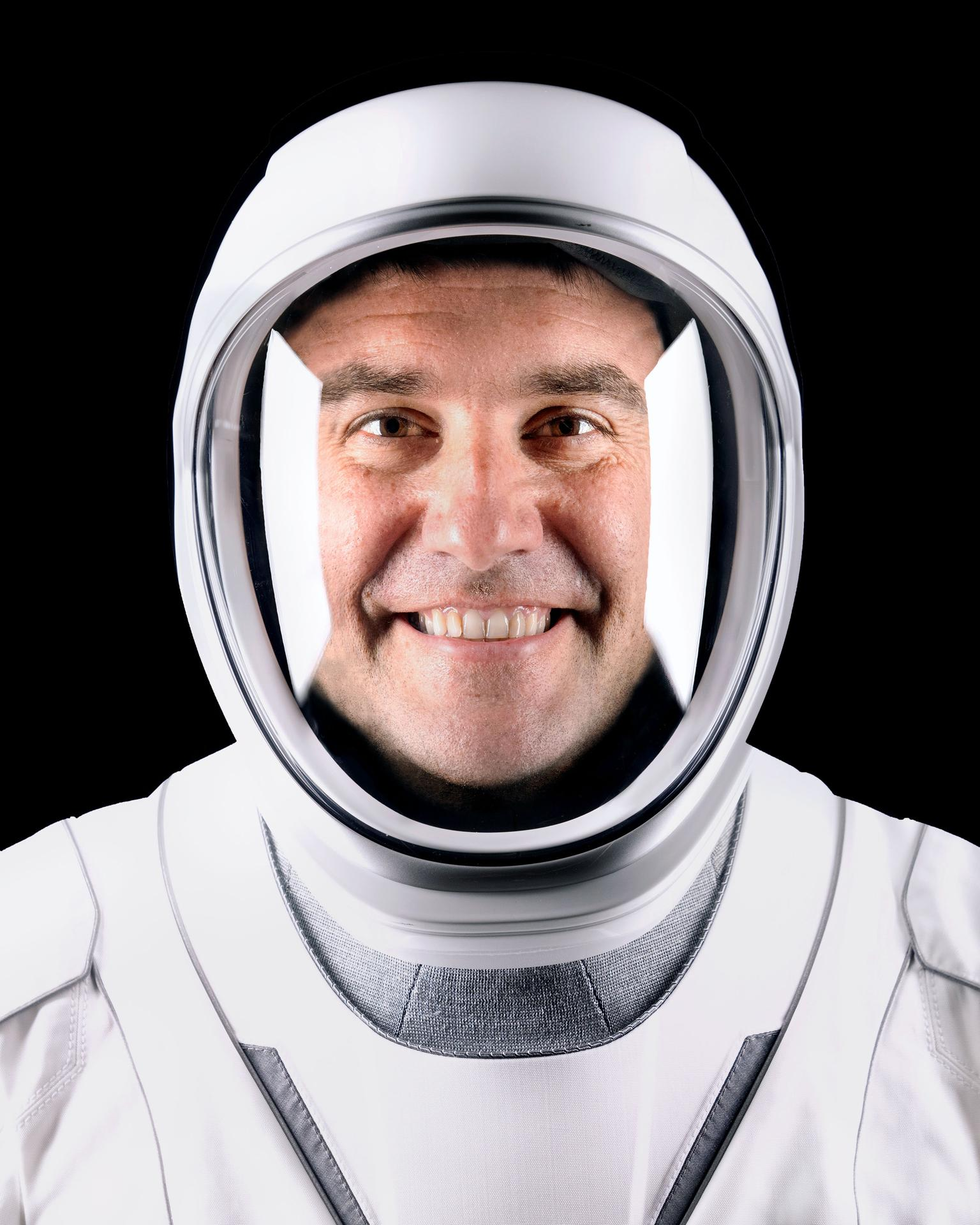 A person in a white spacesuit.