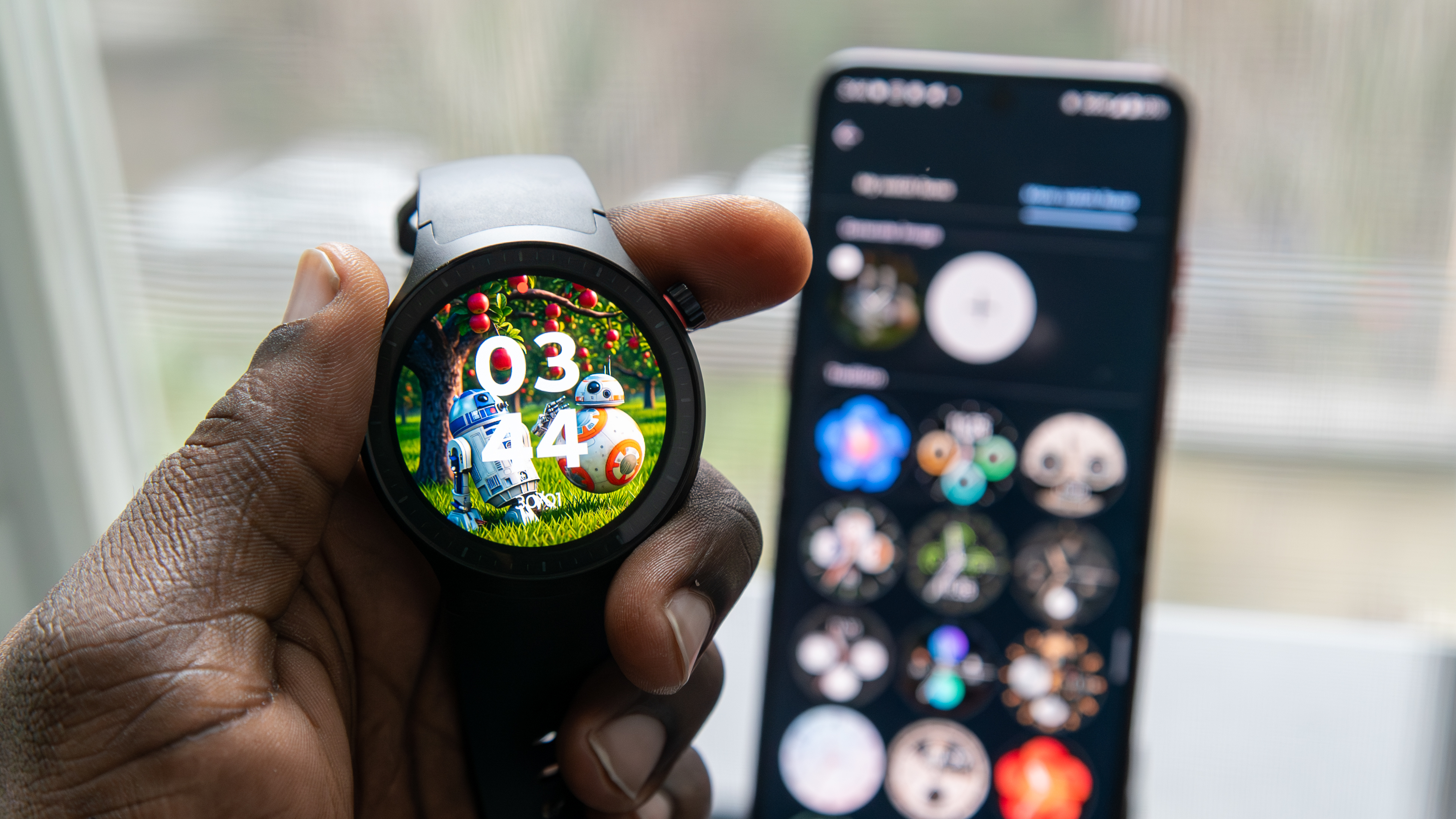 Holding the Moto Watch with an AI-generated watch face