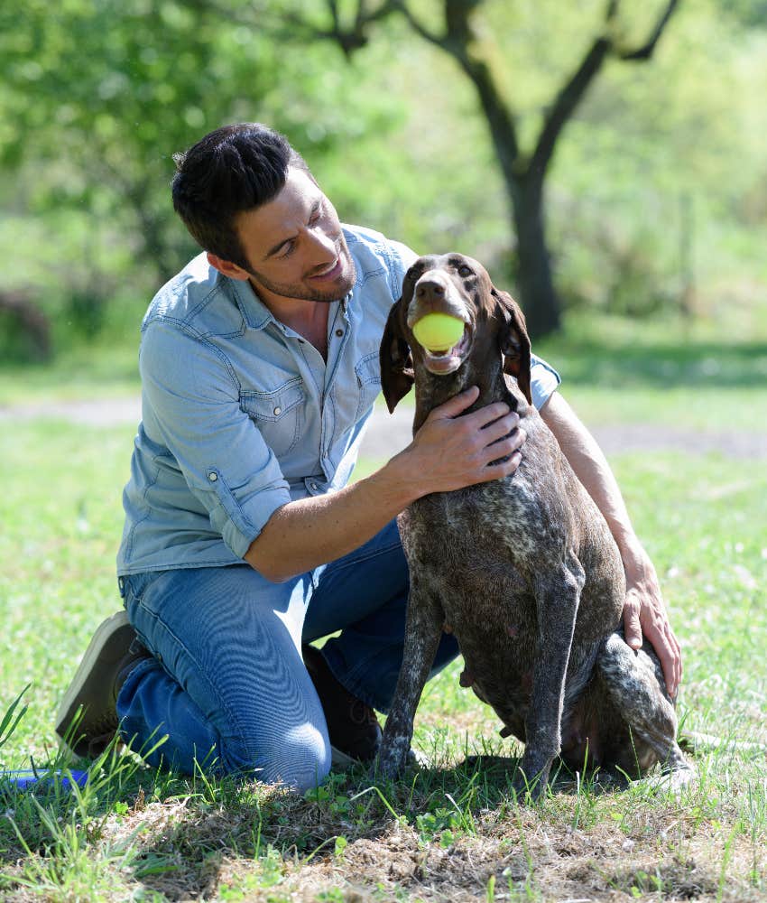 man playing with dog outside secret to a stress-free life