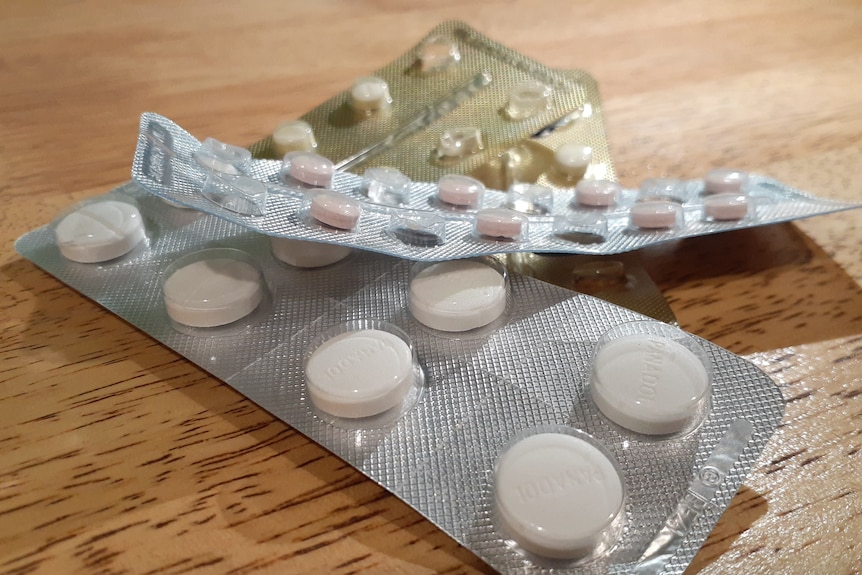 packets of pills in silver blister packets