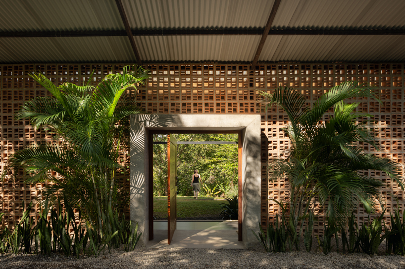 a series of porous brick partitions enclose central garden within costa rica residence