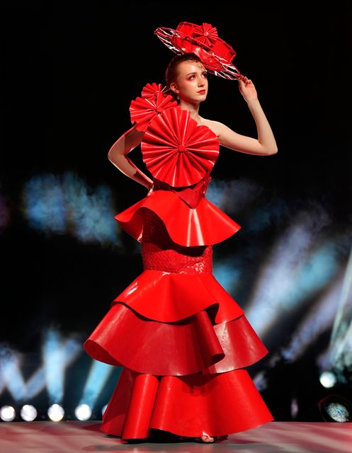 Isabel Ryder wears her design Blazing Muse, which she created with Niamh Donohoe and Lilly Mangan out of recycled materials, during the Junk Kouture World Final at The Helix in Dublin. Picture date: Tuesday February 24, 2026. Niall Carson/PA Wire