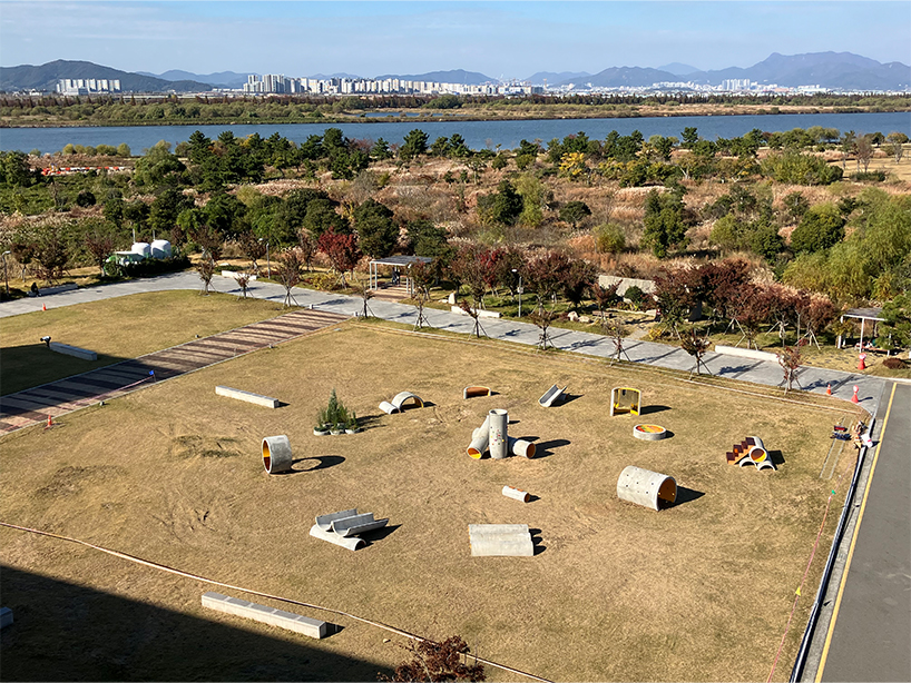 concrete utopia transforms discarded construction pipes into playground in south korea
