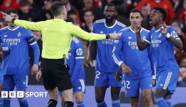 French referee Francois Letexier talks to Vinicius Jr and Real Madrid players after an allegation of racist abuse by Benfica's Gianluca Prestianni