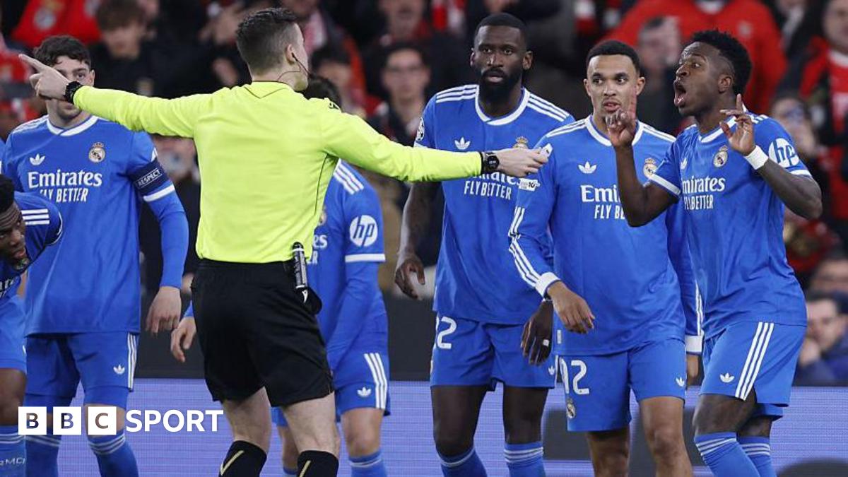 French referee Francois Letexier talks to Vinicius Jr and Real Madrid players after an allegation of racist abuse by Benfica's Gianluca Prestianni