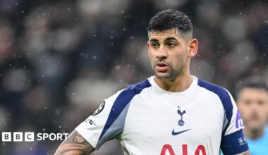 Cristian Romero playing for Tottenham, wearing a captain's armband
