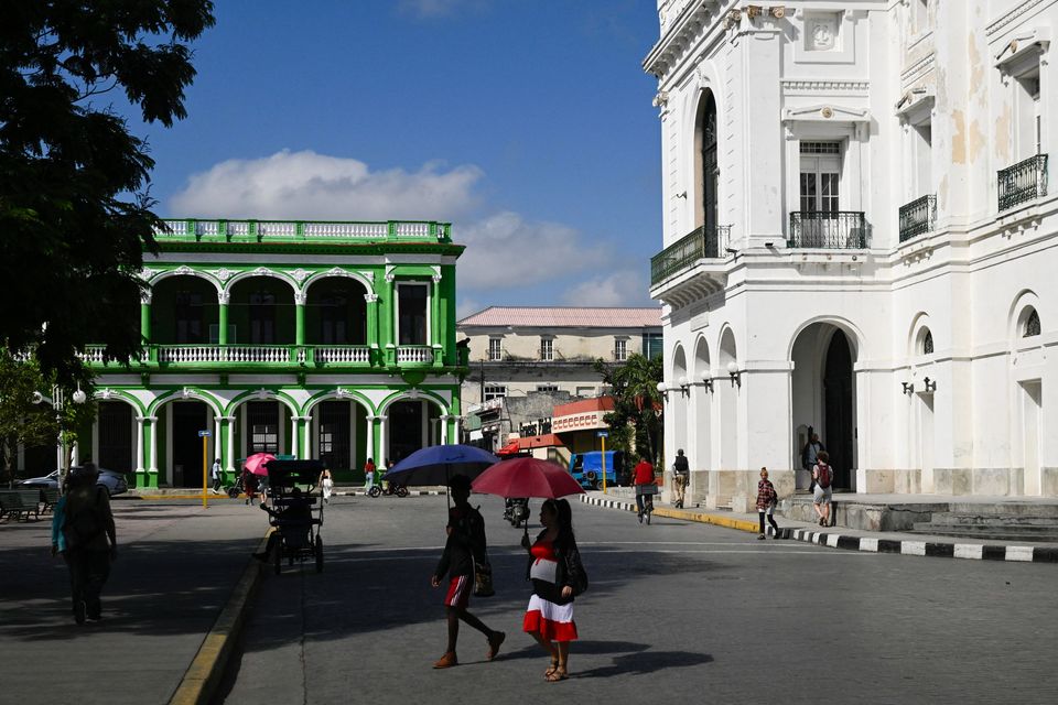 People walk through the city center, following an armed incident involving a Florida-registered speedboat and a Cuban patrol, in Santa Clara, Cuba, February 26, 2026. REUTERS/Norlys Perez