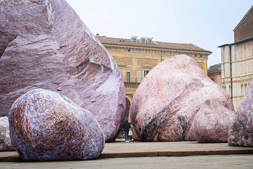 ENESS installs luminous inflatable boulders in bologna's historic piazza maggiore