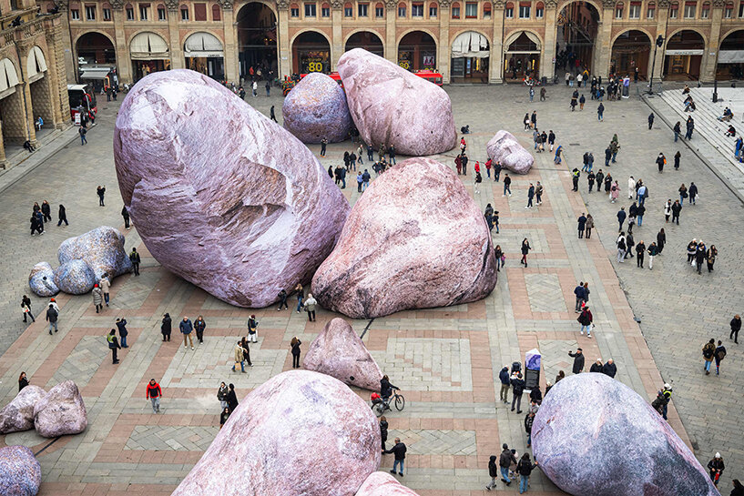 ENESS installs luminous inflatable boulders in bologna's historic piazza maggiore