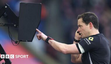 Darren England checks the VAR monitor pitchside