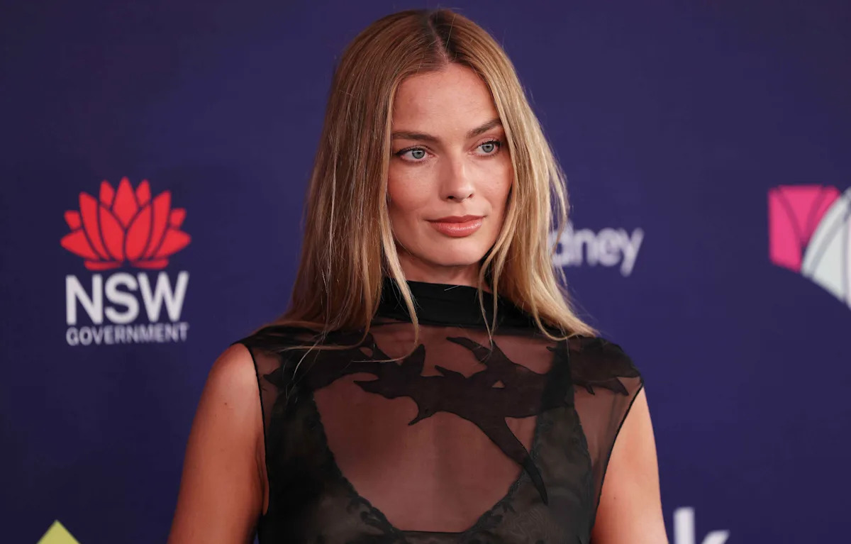 Margot Robbie Wears Nothing but a Thin Layer of Sheer Black Fabric Over Her Bra in a Gothic Ghost Moment