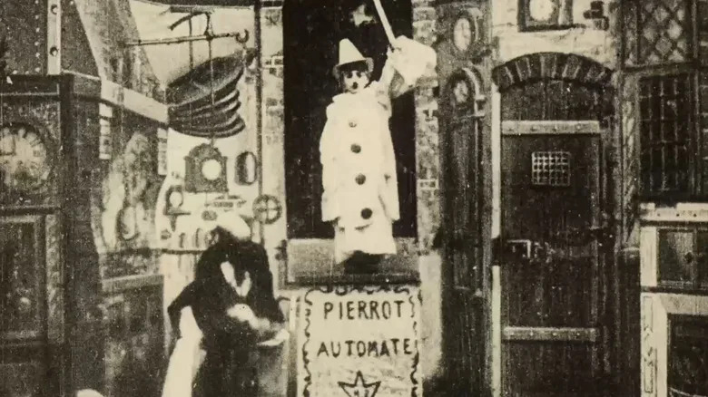 Gugusse with a boy-sized automaton in Gugusse and the Automaton