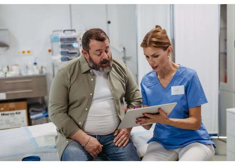 A man consulting with a health-care provider