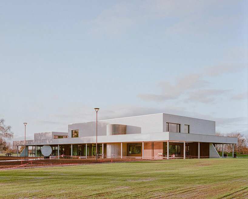 geometric supports guide movement at belgian school extension by LT2A and open architectes