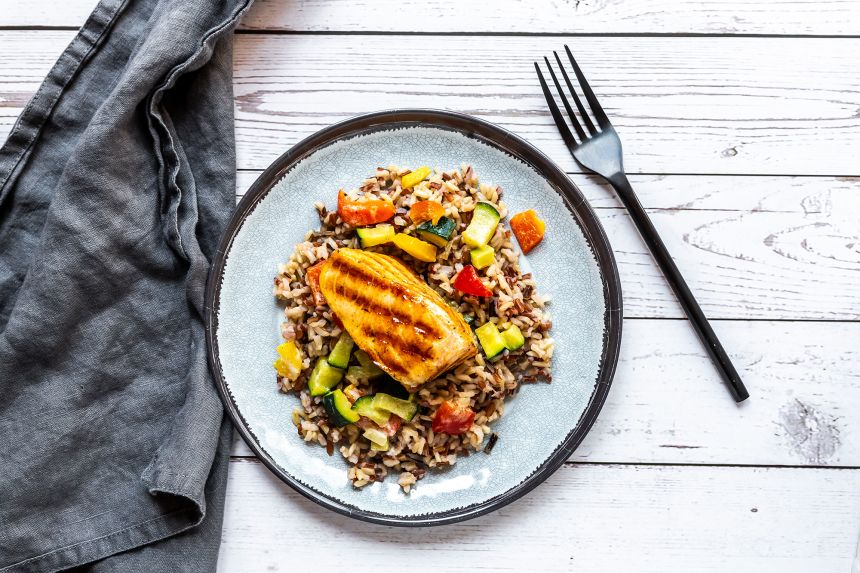 Roasted salmon with wild rice and vegetables can be a nutritious meal for athletes.