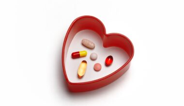 Red heart pill box with six vitamins inside