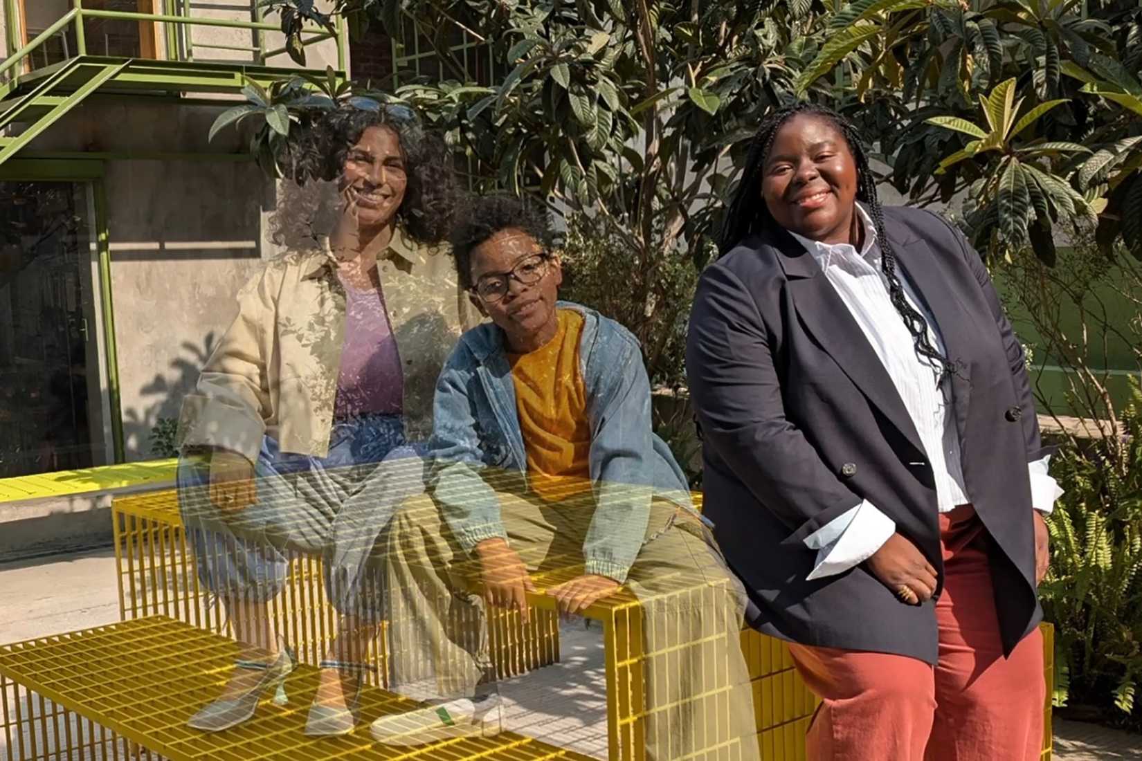 Two people blurred out in a image, the third in focus.