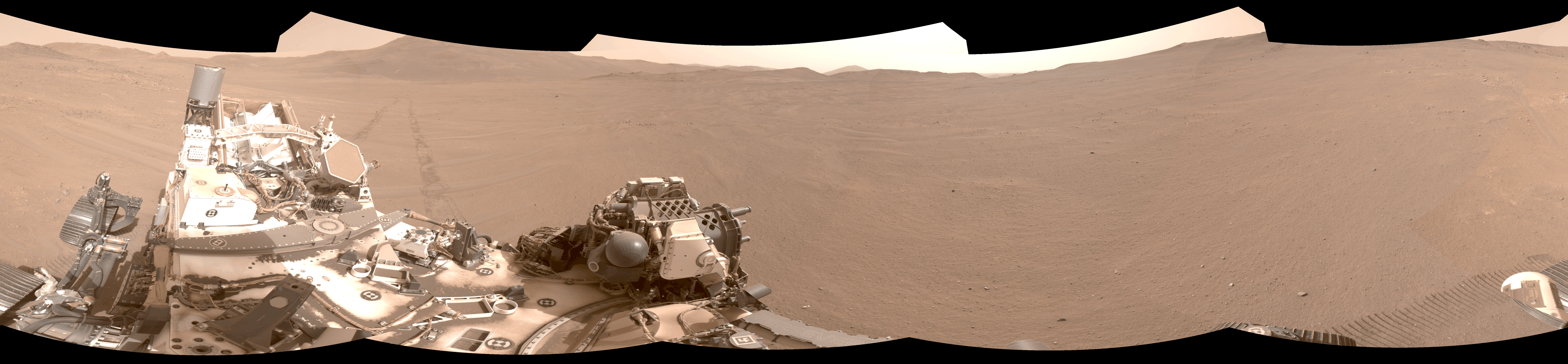 A panorama of Perseverance on Mars. The rover is in the foreground on the left.