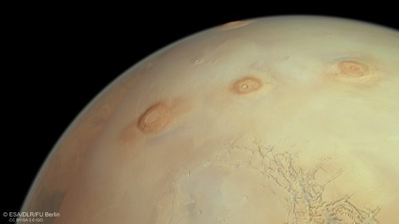This perspective view from ESA’s Mars Express shows three of Mars’ famously colossal volcanoes (from left to right): Arsia, Pavonis and Ascraeus Mons. Image credit: ESA / DLR / FU Berlin.