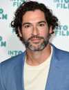 Headshot Of Tom Ellis