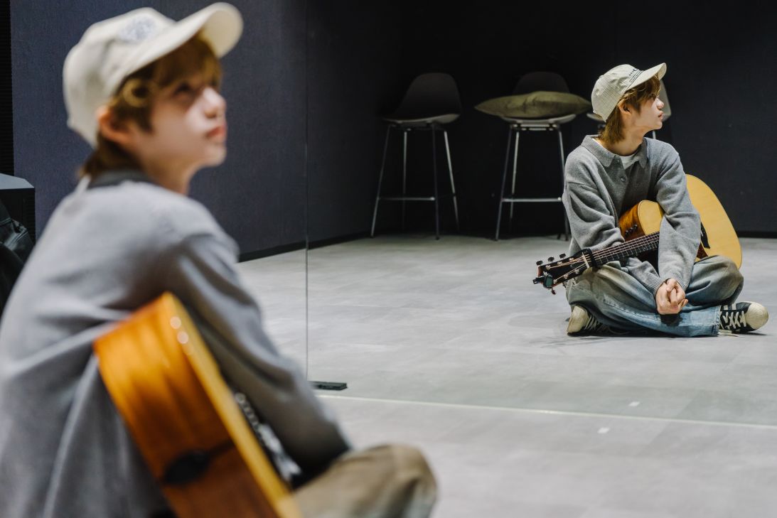 Kenshin Sakurada, the Japanese member of the K-pop boy band Close Your Eyes, practices guitar at UNCORE HQ in Gangnam, Seoul, South Korea, January 24, 2026.