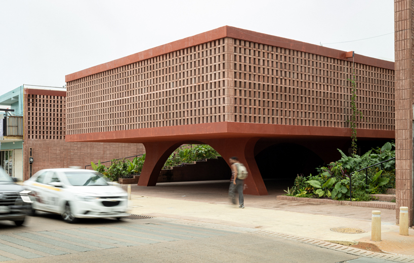 cast in red-pigmented concrete, la cacaotera museum celebrates cacao heritage in mexico - 1