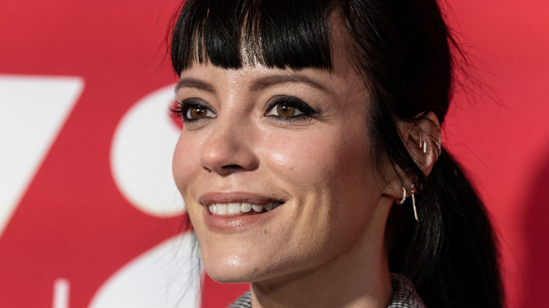 Lily Allen smiling at an event