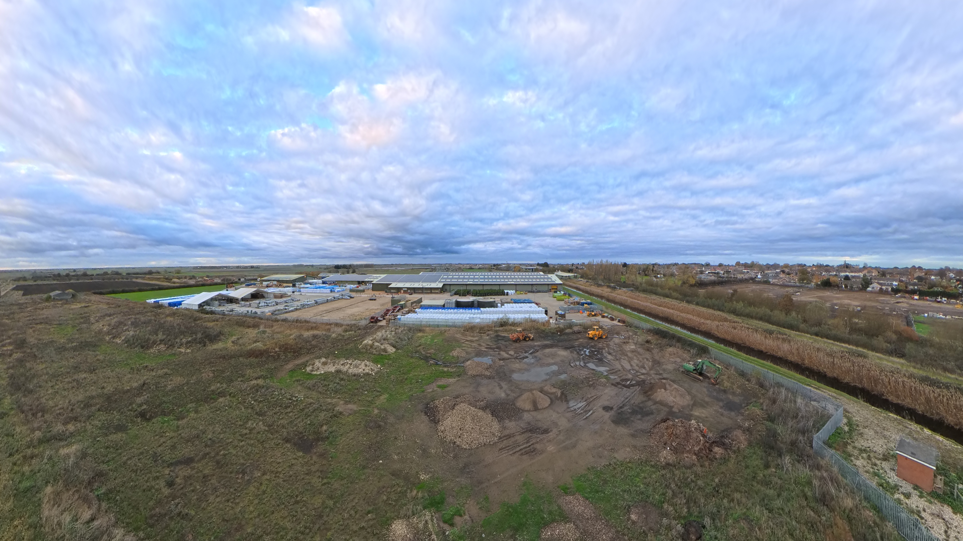 A photo of fields and an industrial site captured with the Antigravity A1 drone