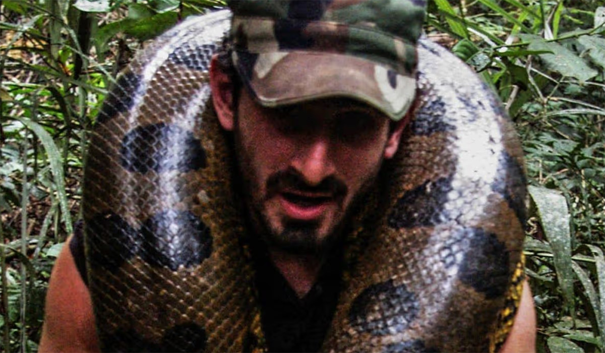 Man who filmed himself getting eaten by snake reveals previous near-death experience