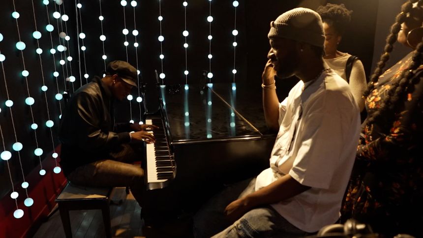 Nigerian musician Pheelz playing piano at Orange Lounge Studio in Toronto.