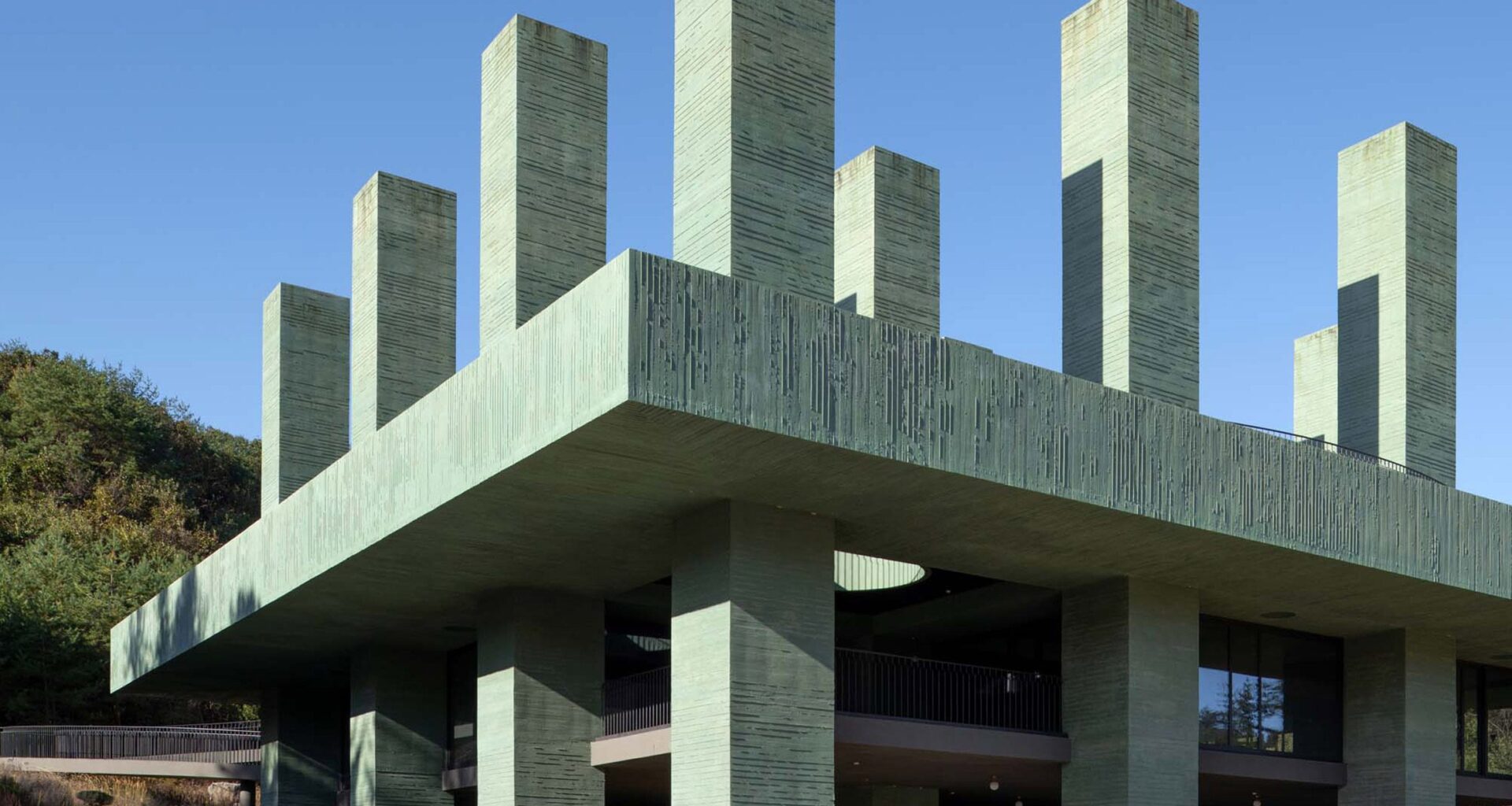 "Obelisk-like" columns rise through restaurant in botanical garden