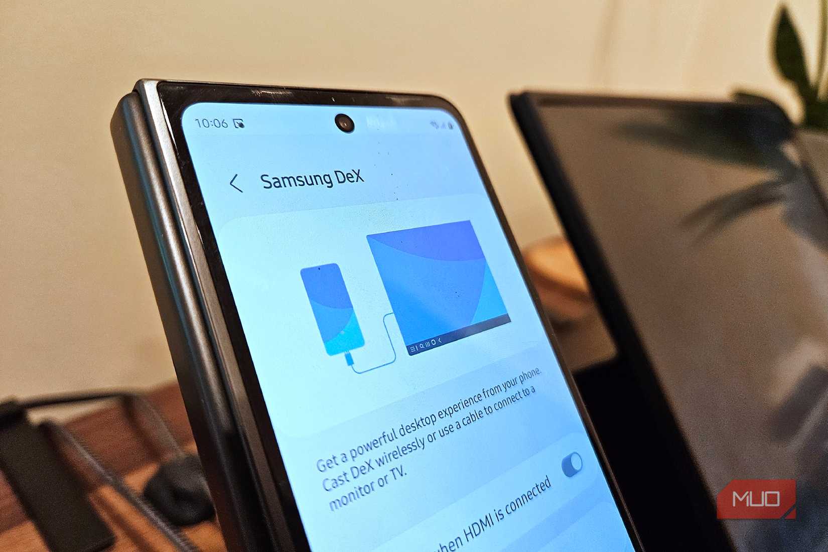 Samsung DeX on a Galaxy Z Fold 5 next to a portable monitor.