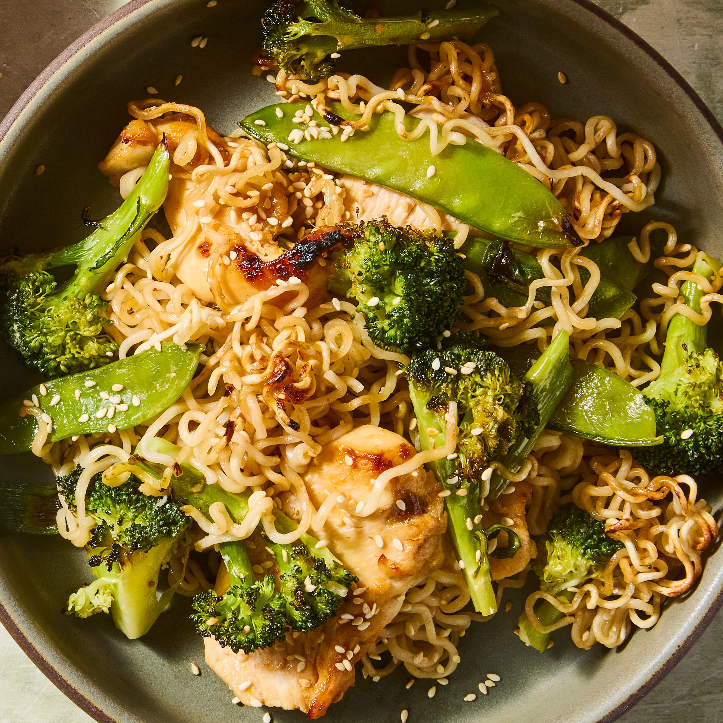 ramen noodles, chicken, and broccoli baked on a sheet pan