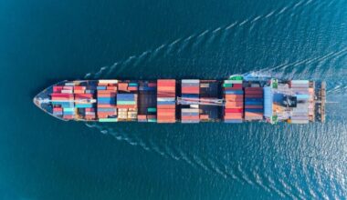 Aerial top view of a containership underway