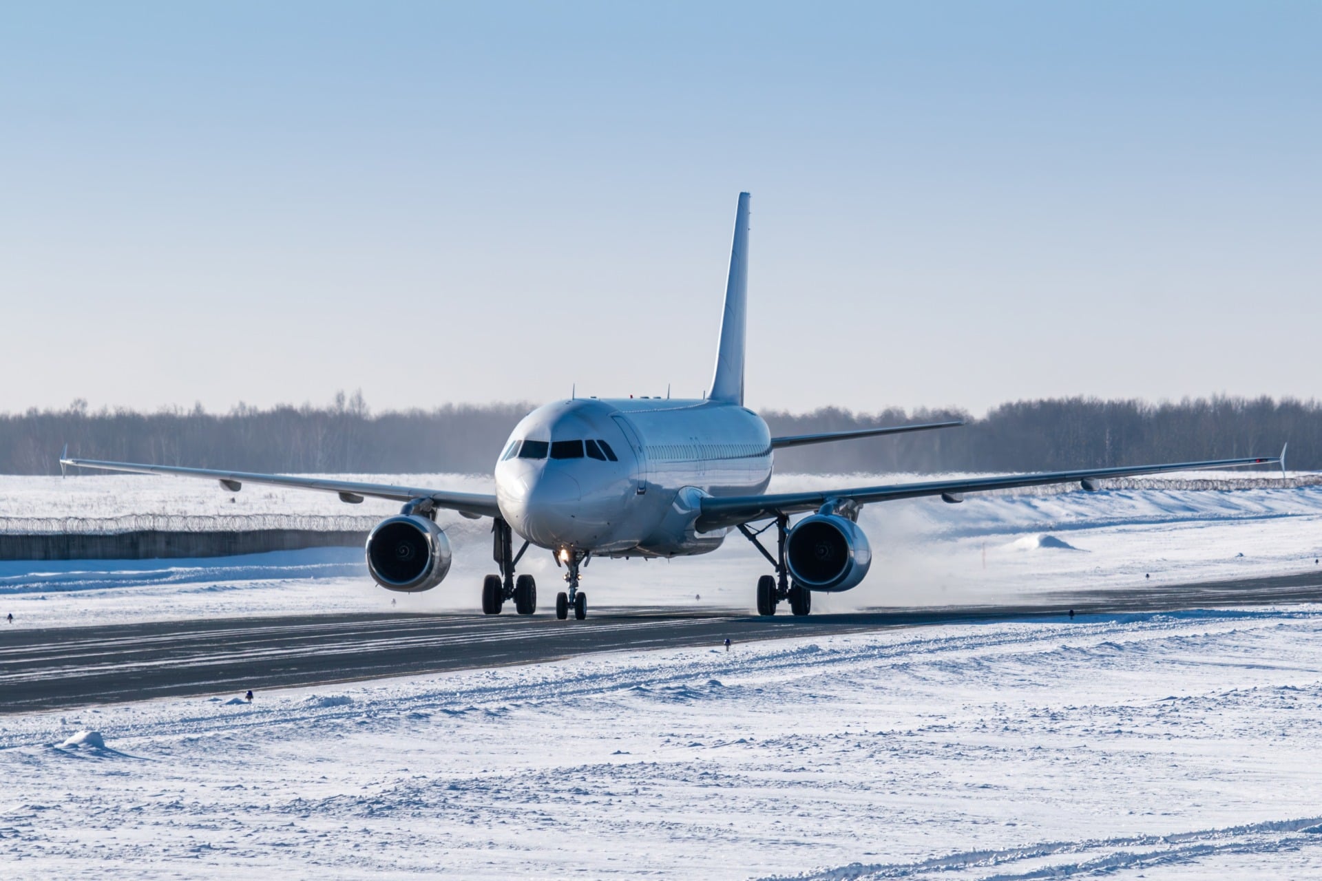An airplane landing in the snow